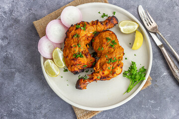 Grilled Chicken Legs with Onion Rings and Lemon Top Down Healthy Food Photo