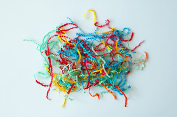 Multicolored filler cut paper serpentine for filling gift boxes. White background.