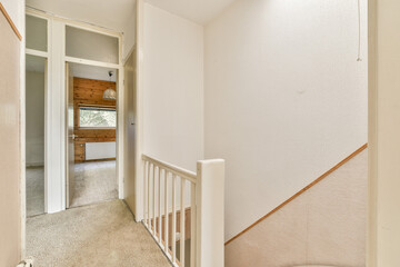 A warm and inviting hallway featuring soft textures, natural light filtering through openings, and...