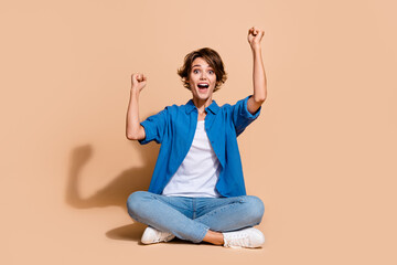 Full body size photo of cheerful overjoyed woman winning surprise award triumphant raised fists up...