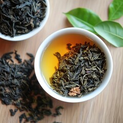 Fototapeta premium Overhead shot of a cup of steeped tea and tea leaves in bowls on a wooden surface. Tea offers comfort and relaxation.