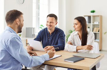 Office meeting, young confident business people signing contract at group negotiations, business...