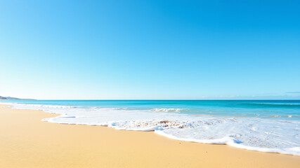 Fototapeta premium The image shows a beach with white sand and blue water