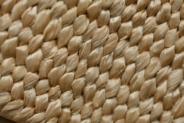 macro texture of summer brown paper hat as background, close up texture of panama hat, paper for panama hat	
