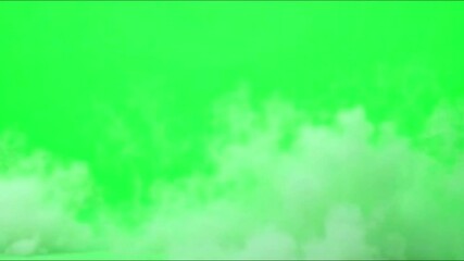 Thick fog or smoke drifts smoothly across a green screen background, ideal for seamless video compositing and atmospheric visual effects.