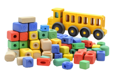 Colorful wooden building blocks and a toy truck  A variety of shapes and sizes of blocks in vibrant colors are arranged with a yellow toy truck
