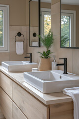 Salle de bain design avec double vasque moderne et meuble en bois clair, ambiance naturelle lumineuse et décoration végétale