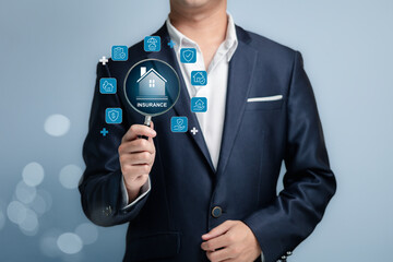 Professional Man Holding Magnifying Glass Focusing on Insurance Concept