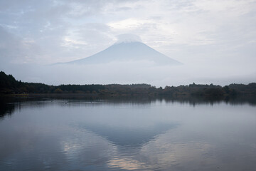 View of Tanuki lake with maple trees in the evening