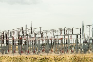 Electrical substation with many metal structures and cables. Control and distribution of...