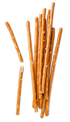 Pile of cracker sticks, pretzels and broken in half on a white background. Top view