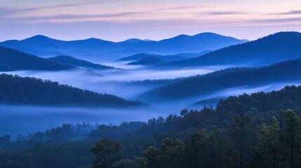 Layers of misty mountains reveal a peaceful natural landscape scene
