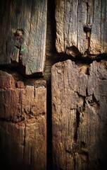 Brown wood with a dark chocolate texture for backgrounds, patterns, or wallpapers, and other surfaces