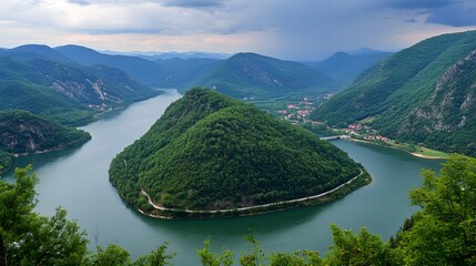 Serene River Bend Surrounded by Lush Green Mountains