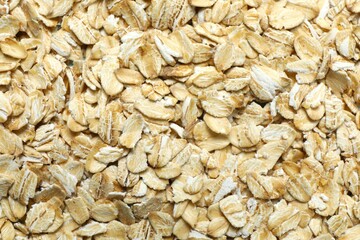 Oatmeal flakes as a background. Cooking breakfast