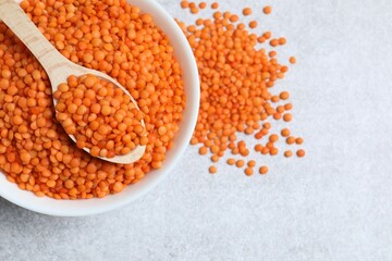 Red lentils on a gray background