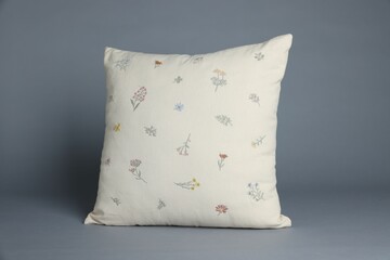 One soft decorative pillow on grey background