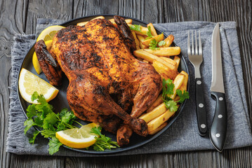 whole crispy skin roasted chicken on a platter