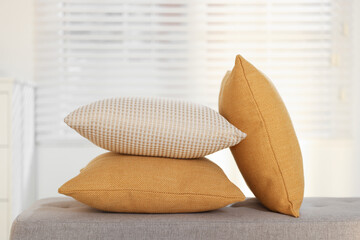 Soft decorative pillows on sofa in room