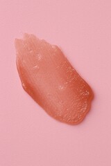 Moisturizing lip balm on pink background, top view