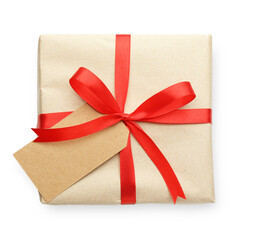 Gift wrapped in kraft paper with bow and card isolated on white, top view