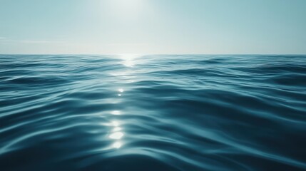 Obraz premium The vast and shimmering blue ocean under a clear bright sky