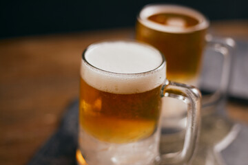 mug of beer on wooden table.