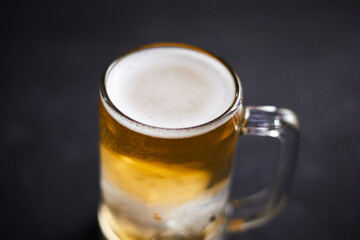 mug of beer on wooden table.
