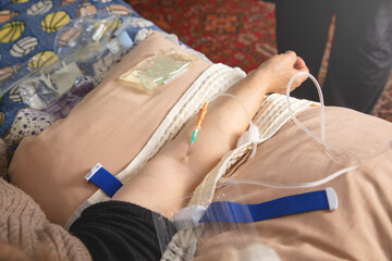 Woman lies in a bed at home. Taking vitamins