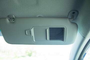 View of mirror inside car. Transport