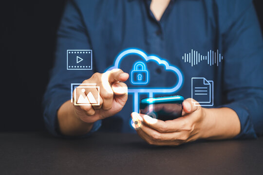 Man using smartphone to access secure cloud storage with multimedia icons on a dark background.