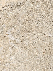 Close-up of a rough, porous stone surface, ideal for architectural detail and textures
