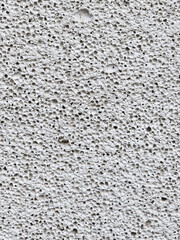 Close-up of porous concrete surface texture.