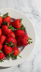 Fresh red strawberries in a white plate, perfect for summer picnics and healthy eating, vibrant fruit harvest concept