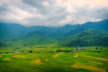 Obraz premium Beautiful Mountain landscape foggy windy mountain range green landscape asian farm. Amazing Landscape mountain green field meadow white cloud blue sky on sunrise. Countryside sunlight heaven scenery