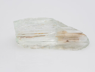 A Roughly Cut Pale Green Beryl Crystal Specimen Exhibiting Schiller Effect, with Visible Inclusions...
