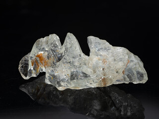 A stunning, transparent natural beryl crystal specimen showcasing a complex, jagged structure with...