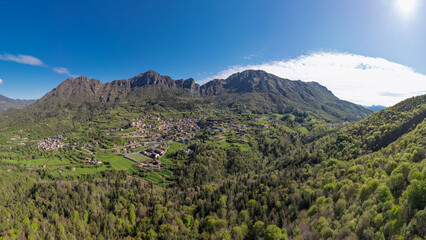Aerial view from the drone of the village of Lodrino in Val Trompia in the province of Brescia, Lombardy Italy. Surrounded by mountains and greenery, the village is a quiet area where you can relax an