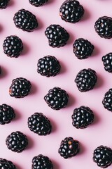 Flat lay photo with blackberries on a bright background. Juicy and vibrant composition ideal for healthy food, summer, and organic lifestyle themes.