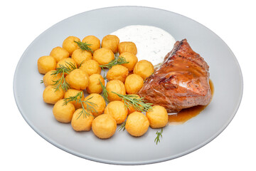 Pork chop with potatoes and sauce. Isolated over white background