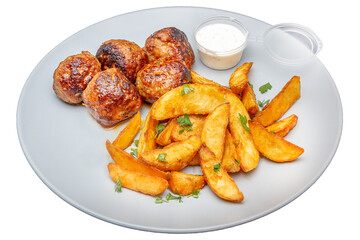 Meatballs with potatoes and sauce on a plate. Isolated over white background