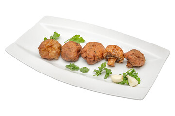 grilled championsedit with parsley and garlic on a white plate. Isolated