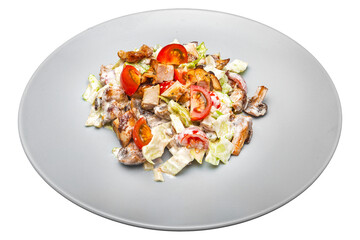 Salad with chicken and vegetables on a plate. Isolated over white background
