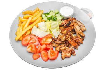 Plate with kebab, french fries and salad. Isolated over white background