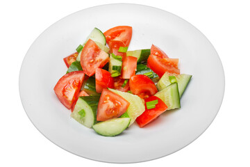 Salad with cucumbers and tomatoes. Isolated over white background