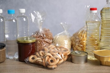 Many different food products on wooden table, closeup