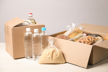 Different food products in boxes on light table