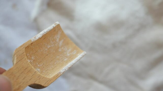 pouring baking soda on a cloth 