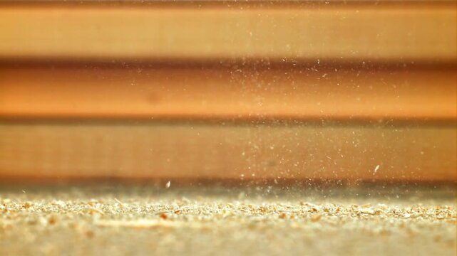 Wood sawdust on the carpenter's desktop. Filmed on a high-speed camera at 1000 fps. High quality FullHD footage