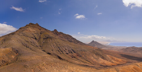 Dramatic aerial panoramic image of Montana Cardon, the Jandia peninsular and the volcanic mountain...